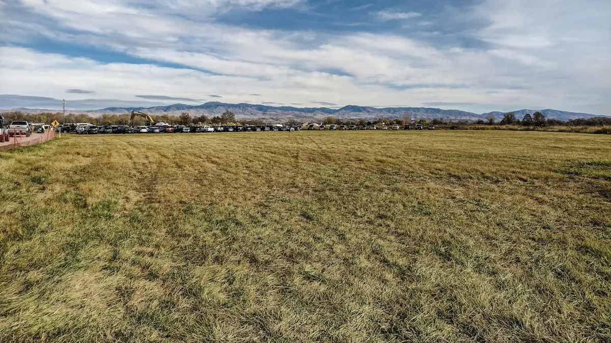 Open grassland at the edge of town with mountains on the horizon - Leak Detection in Canyon Hill