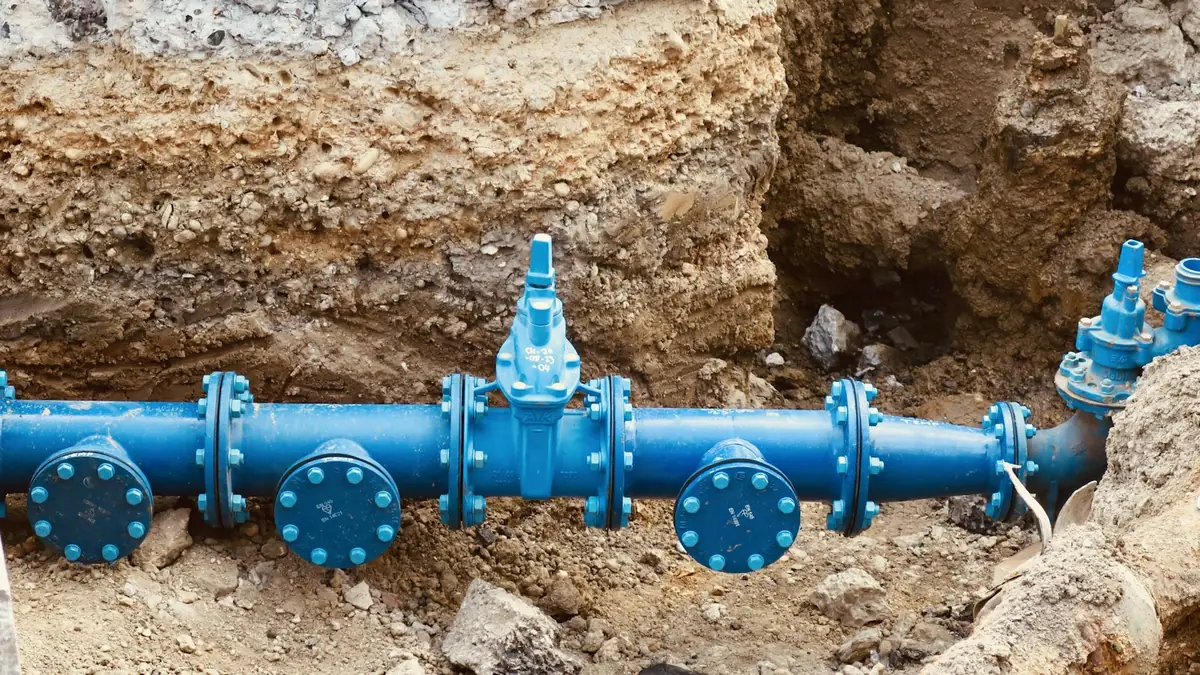 Blue water main pipes and valves in an open trench - Leak Detection in Canyon Hill